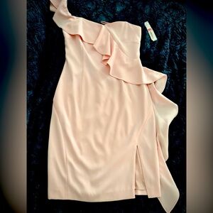 Elegant baby pink one shoulder dress. Perfect for any special occasion.